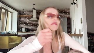 A pretty slut gets a messy cumshot on her glasses