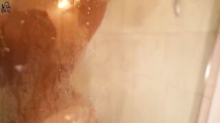 A young girl caresses her body with her fingers in the shower