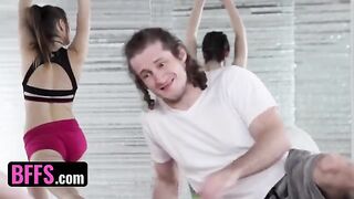 A yoga enthusiast is having fun with his coach and classmates during a session
