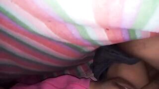 An amateur couple has missionary sex under the sheets