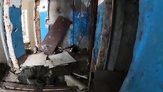 A sexy girl is walking around a terrible house with her boyfriend