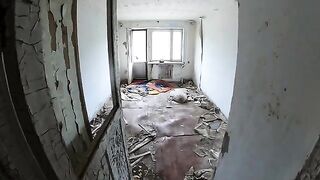 A sexy girl is walking around a terrible house with her boyfriend