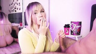 A cute girl is smoking a cigarette or making a blowjob