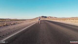 A young girl is having fun on her skateboard and meets a guy
