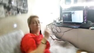 A mature woman plays sexy games with her pussy on camera