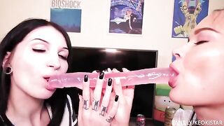 Two lesbians fuck each other with their juicy pussies using a double-ended dildo