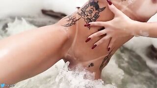 A stunning woman is having fun in the hotel pool with someone amazing!