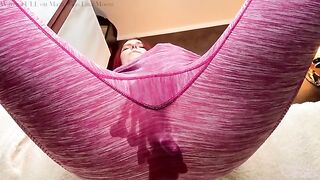 The girl is stretching her ass with a butt plug and fingers