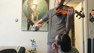 A couple trying to practice violin together with a passionate and intimate session