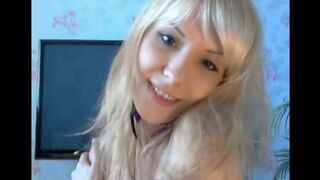 Blonde caresses her pussy with fingers in a hot solo session