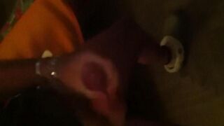 The guy masturbates in front of the mirror with pleasure