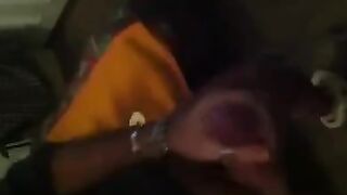 The guy masturbates in front of the mirror with pleasure