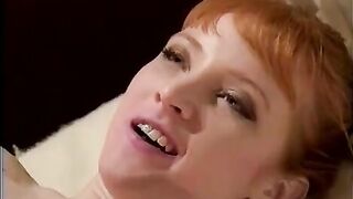 Two hot lesbian nurses are using a big strap on dildo to fuck each other