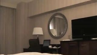 He undressed the whore in the hotel room for sex