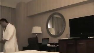 He undressed the whore in the hotel room for sex