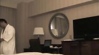 He undressed the whore in the hotel room for sex