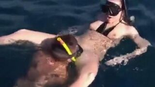 Aquatic sex of aqualangists at the bottom of the sea