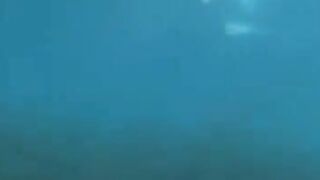 Aquatic sex of aqualangists at the bottom of the sea