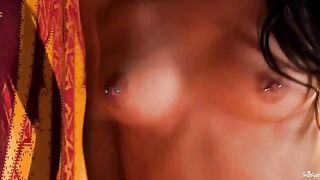 A girl with a clitoral piercing masturbates, stimulating her sensitive area