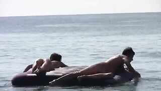 A naked beauty has fun on the sandy beach