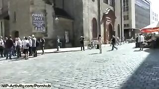 The girl walked naked in the city and showed her tits in public