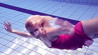 Babe Helen takes a swim in the pool without any swimming suit
