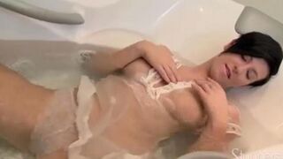 Brunette takes shower and masturbates her pussy