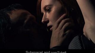 A red-haired girl was tied up and fucked in a dark room