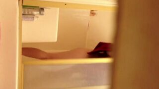 A girl washed in the shower, not knowing that she was filmed