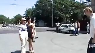 Brunette model trying on clothes in public, almost caught
