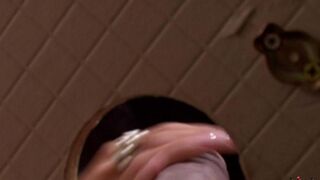 A blowjob from a beautiful woman through a toilet hole