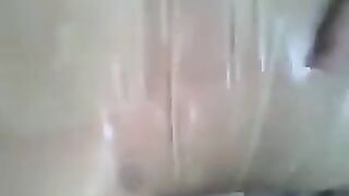 A guy put a condom on his dick and masturbated with his hand