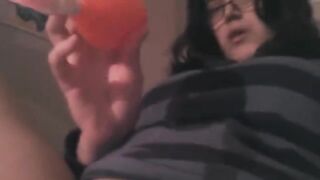 Stimulation of the clitoris with a vibrator on the bed