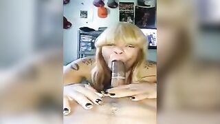 A black woman has a great dick in her mouth wrapped in a condom
