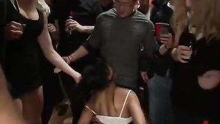 A mature woman in rough bondage, penetrated by several cocks in an intense scene