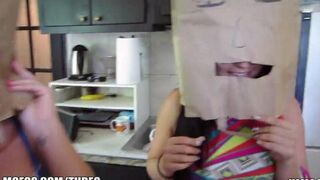 The girls wear bags on their heads while having sex