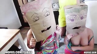 The girls wear bags on their heads while having sex