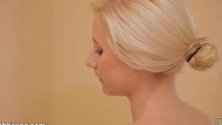 Hot girl masturbates with a toothbrush handle in the bathroom