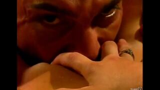 A couple enjoy each other on the couch with passionate intensity