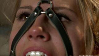 A woman with beautiful big tits in hard bondage play