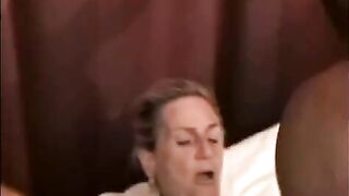 A mature woman is having fun with a black man in this hot video