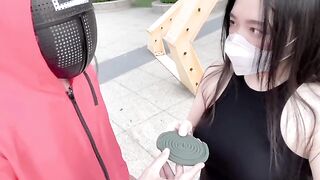 A hot Chinese girl participates in a risky game with sexy consequences