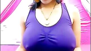 A girl is very excited and her nipples stick out through her T-shirt