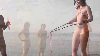 A naked beauty played on the beach with a beautiful body