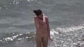 A couple of nudists enjoy a day at the beach