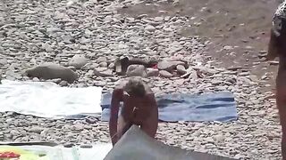 A couple of nudists enjoy a day at the beach