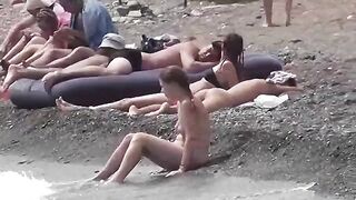 A couple of nudists enjoy a day at the beach