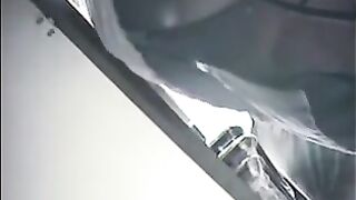 The employee set up a camera under the skirt of the checkout girl