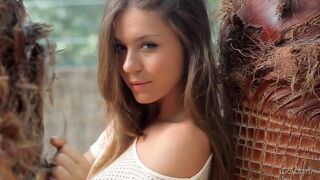 A young Russian girl named Anastasia is stripping in front of the camera