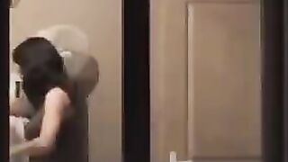 He admires his reflection in the mirror completely naked